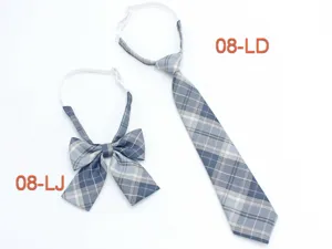 Blue plaid JK uniform tie and bow tie set detail view, featuring adjustable strap design.