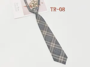Close-up detail view of grey plaid JK necktie fabric texture and pattern design.