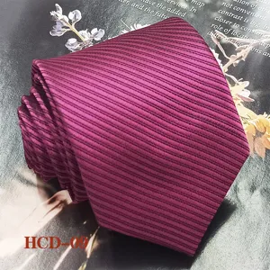 Jacquard striped red necktie detail shot, elegant fabric texture for men formal business wear.
