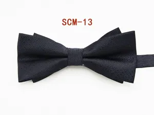 Detailed shot of a classic black double layer fabric bow tie for men formal business wear.