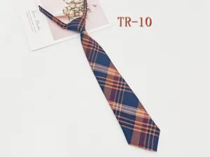 Detailed view of the pre-tied JK plaid necktie, classic blue and orange check pattern fabric.