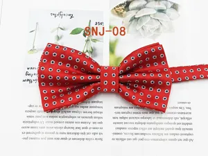 Red patterned polyester bow tie detail showing the exquisite geometric dot design for formal wear.