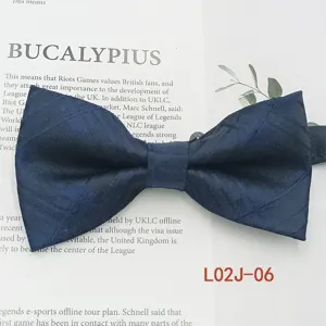 Closeup detail of navy blue jacquard striped bow tie, elegant men formal wear accessory.