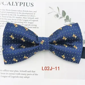 Detailed view of mens blue jacquard bow tie showcasing cute teddy bear and dot pattern.