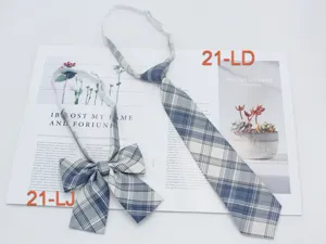 Close up of Japanese JK uniform blue plaid necktie and bow tie set detail display.