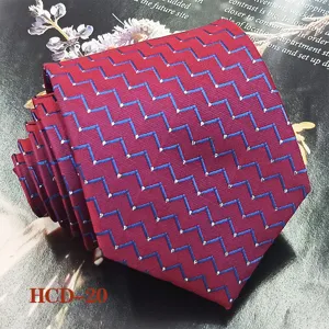 Men's red jacquard woven polyester necktie close-up, elegant chevron pattern for formal wedding.