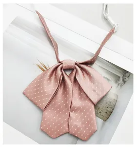 Pink polka dot JK bow tie for women, sweet Japanese college style uniform collar accessory.