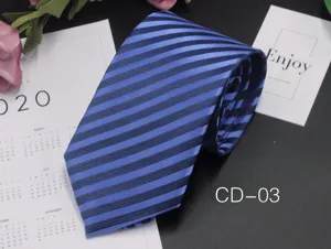 Detailed view of the classic blue and dark blue striped business tie, elegant texture.