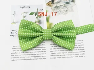 Green polka dot men's bow tie, classic double fold design, perfect for formal business wear.