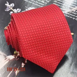 Red jacquard men tie detail view, elegant textured pattern, professional business apparel.