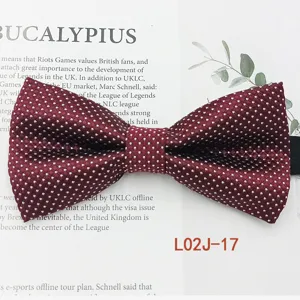 Detailed view of a classic burgundy polka dot bow tie, perfect for business and casual wear.