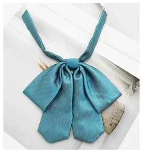 Teal polka dot JK bow tie detail, Japanese uniform accessory, cute jacquard fabric.