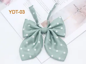 Green polka dot JK collar bow tie, cute student uniform necktie detail and accessory.