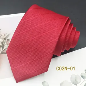 Red jacquard woven men's formal suit necktie detail view, stylish and elegant design.