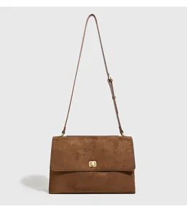Brown retro suede shoulder bag detail, elegant commuter crossbody bag with metal lock.