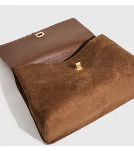Brown retro suede shoulder bag detail view, premium texture, leather lining, metal lock.
