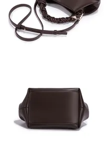 Detailed view of the dark brown women's handbag featuring a braided top handle and strap.