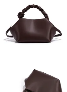 Dark brown leather shoulder bag detail, elegant braided top handle design for modern women.