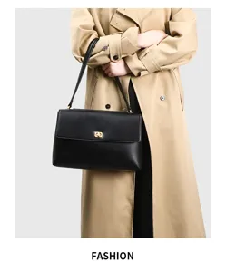 Vintage large capacity women commuter shoulder handbag, elegant black leather design for daily use.