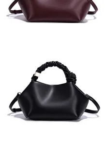 Detail view of the stylish women shoulder bag featuring a braided handle and sleek leather.
