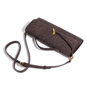 Brown woven leather shoulder bag with adjustable strap and chic metal knot closure for women.