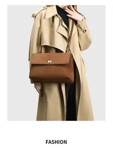 Stylish retro suede shoulder bag for women, large capacity commuter handbag with elegant design.
