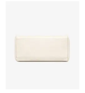 Detailed view of the bottom and neat stitching of a minimalist beige shoulder bag.