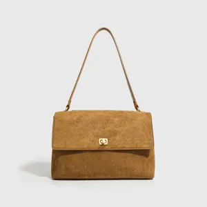 Vintage brown suede shoulder bag for women, elegant commuter underarm handbag with lock.