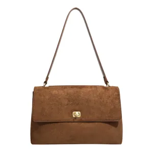Vintage brown suede shoulder bag for women, minimalist underarm handbag for daily commuter.