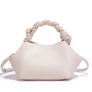 Beige women's shoulder crossbody bag with stylish braided handle and unique shell shape design.