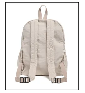 Minimalist solid color nylon backpack with spacious storage capacity and comfortable straps.