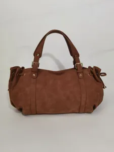 Brown simple commuter handbag detail view, solid color tote bag with double handles.