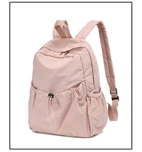 Casual pink nylon backpack, lightweight daily travel daypack for students and adults.