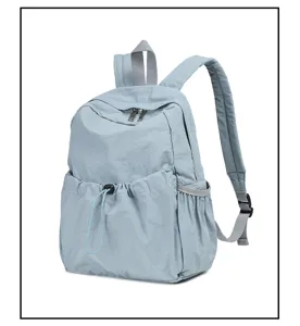 Detail view of the lightweight grey-blue nylon casual backpack featuring adjustable straps.