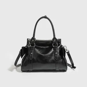 Black retro motorcycle style handbag, compact bow shoulder crossbody bag for women.