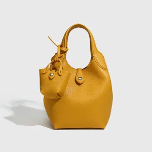 Minimale gelbe Leder Eimer Handtasche fuer Damen, schicke Mini Beuteltasche Hauptansicht.