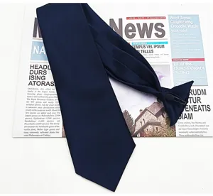 Details of the navy blue pre-tied necktie featuring convenient clip-on buckle design.