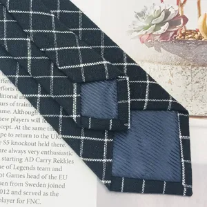 Classic black and white plaid slim neckwear main product view showing tailored back details.