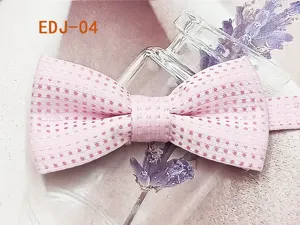Pink polka dot bow tie detail shot, cute double layer fabric children pet accessory.