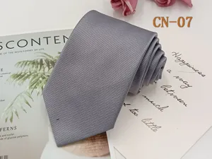 Classic grey men's business tie with elegant diagonal stripe texture for formal wear.