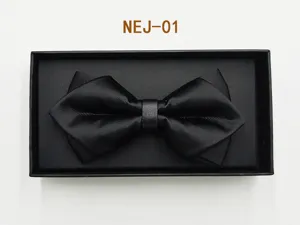 Black silk bow tie detail shot, elegant formal wedding groom suit accessory gift box