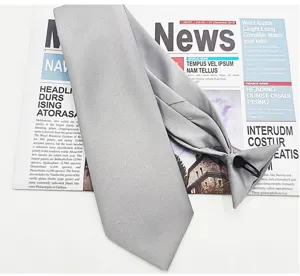 Men's solid grey pre-tied necktie with clip, formal business suit accessory detail view.
