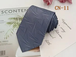 Classic men's business necktie in blue-grey with modern geometric woven pattern. Perfect fit.