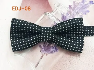 Detailed shot of a classic black bow tie featuring white polka dots, stylish double layer design.