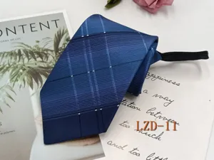 Close-up detail of blue striped zipper tie with pre-tied design for men's business wear.