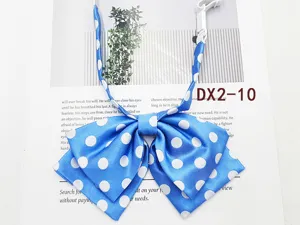 Close-up detail of a blue and white polka dot JK sailor uniform bow tie with clip.