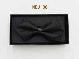 Detail shot of black bow tie with leather ring in black gift box close up elegant