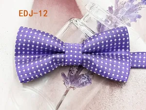Detail shot of purple polka dot bow tie, showing fabric texture and double-layer design.