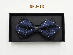 Blue and black plaid bow tie detail shot, elegant formal suit accessory in a black gift box.