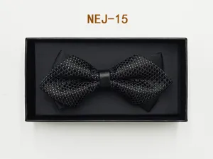 Black patterned bow tie detail in gift box, elegant formal wear accessory for men.